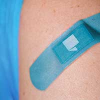 Covid Vaccine Shot in Arm Bandaid