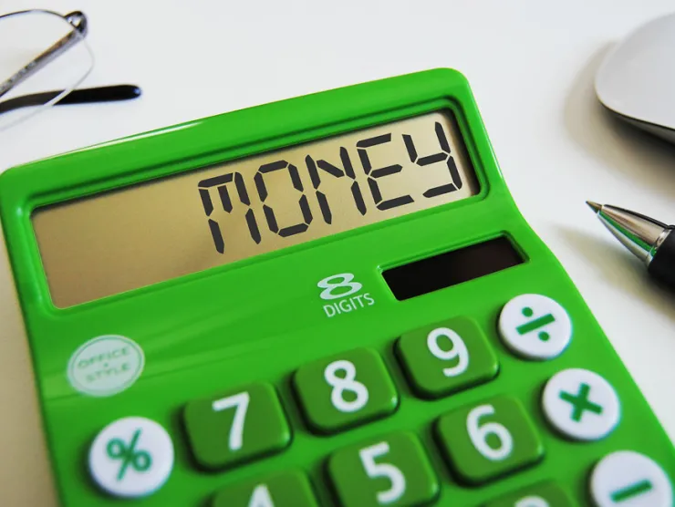 Green calculator that displays, "MONEY"