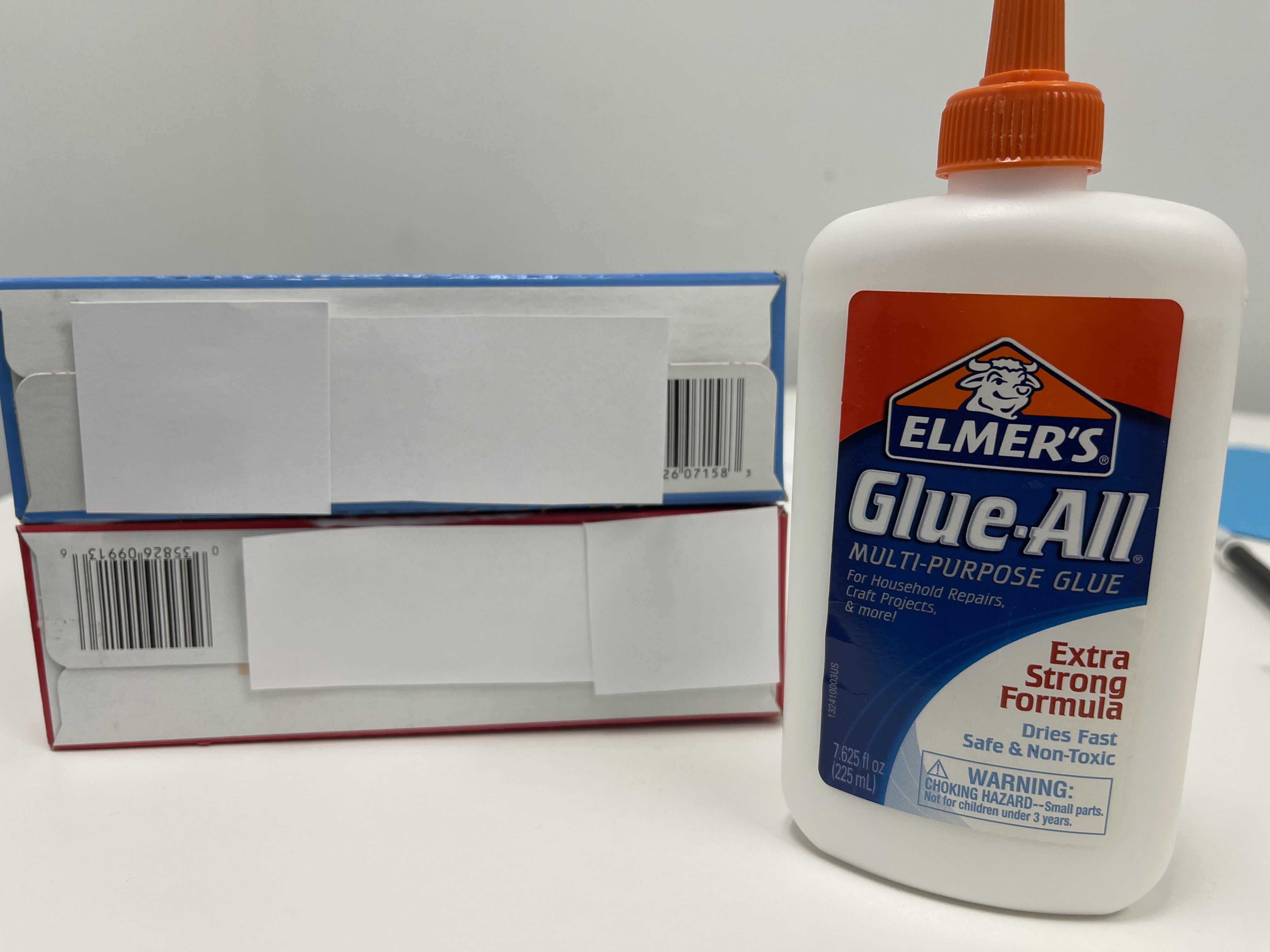 white glue bottle and cereal boxes